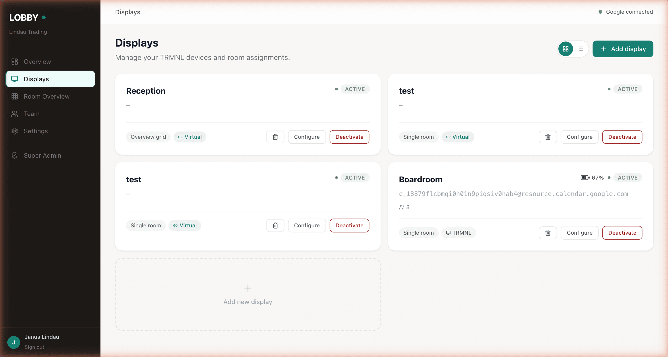 Lobby dashboard Displays page showing four display cards — Reception as a virtual overview grid, two virtual test rooms, and a Boardroom running on a TRMNL device at 67% battery.