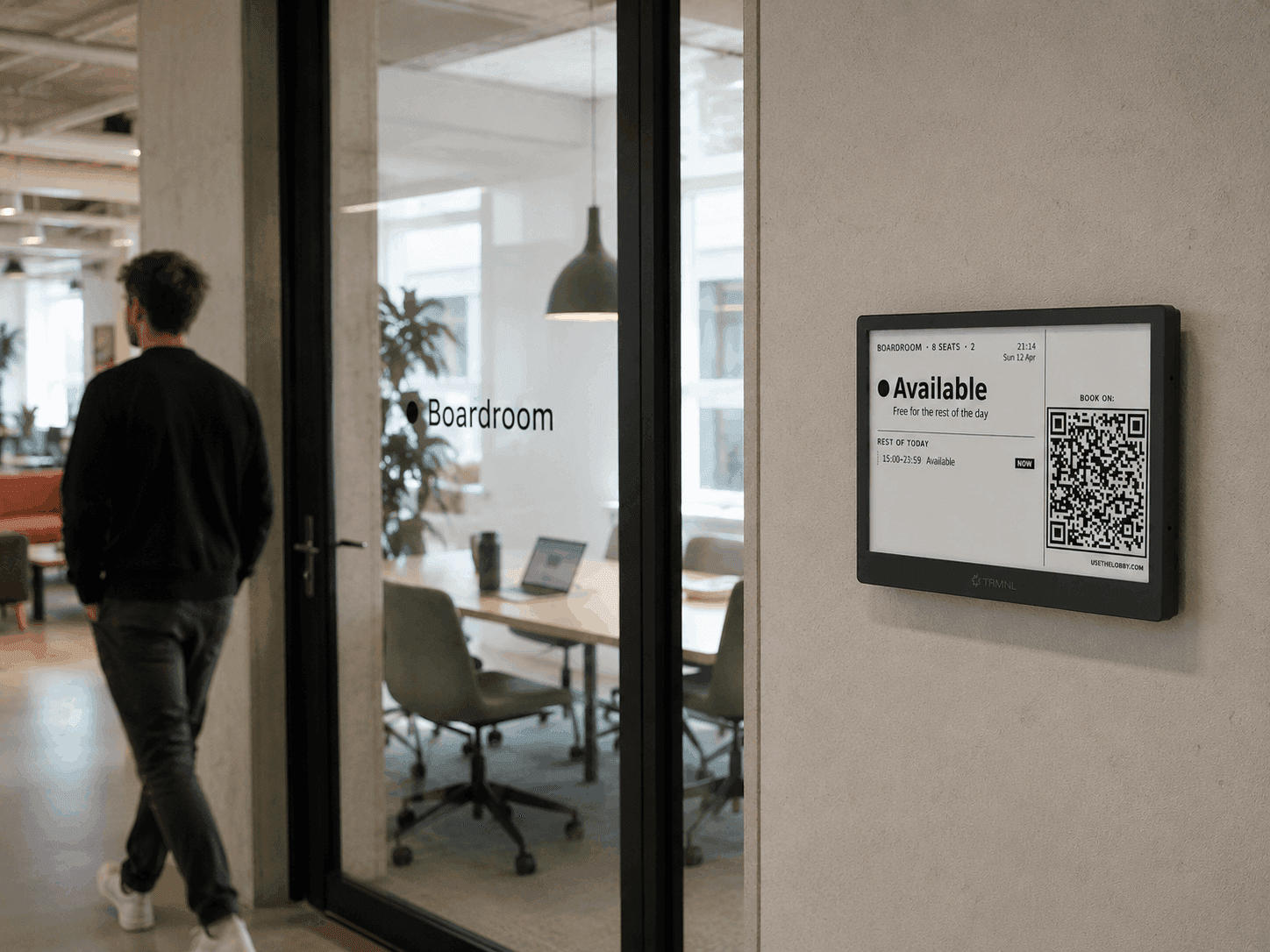Battery-powered TRMNL e-ink meeting room panel showing a room's availability